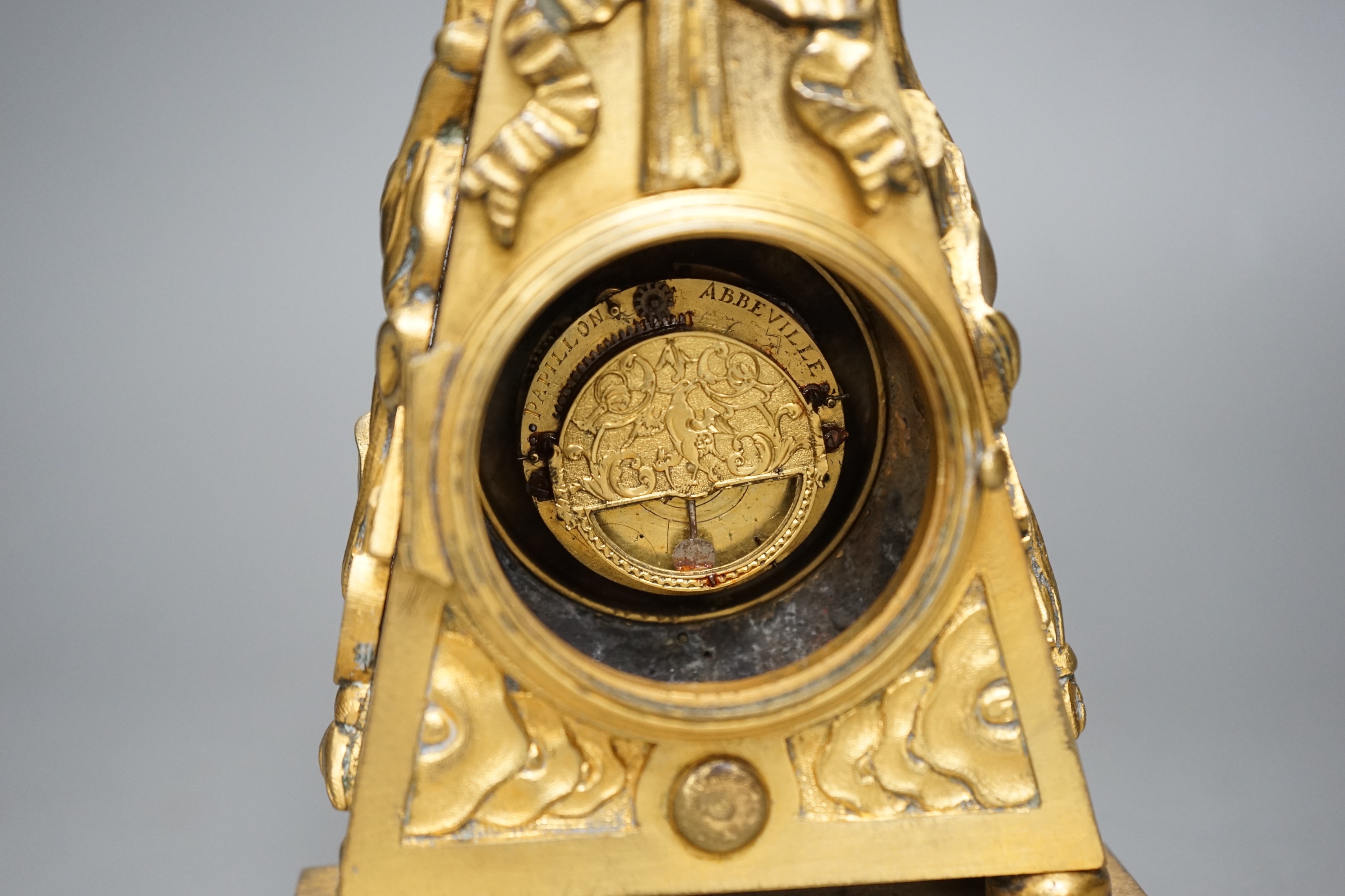 An 18th century French ormolu mantle timepiece with convex enamelled dial, 20cm